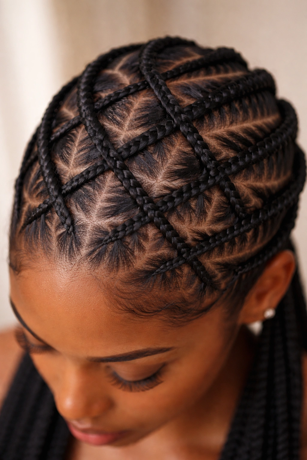 Close-up of criss-cross cornrow pattern on scalp