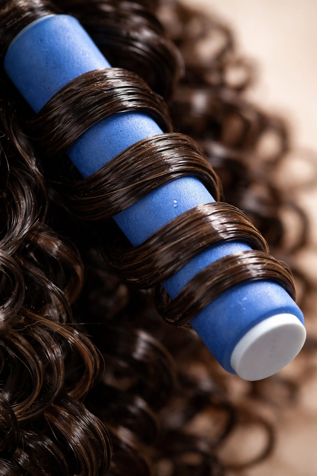 Close-up of a flexi-rod wrapped with damp curls forming bouncy coils