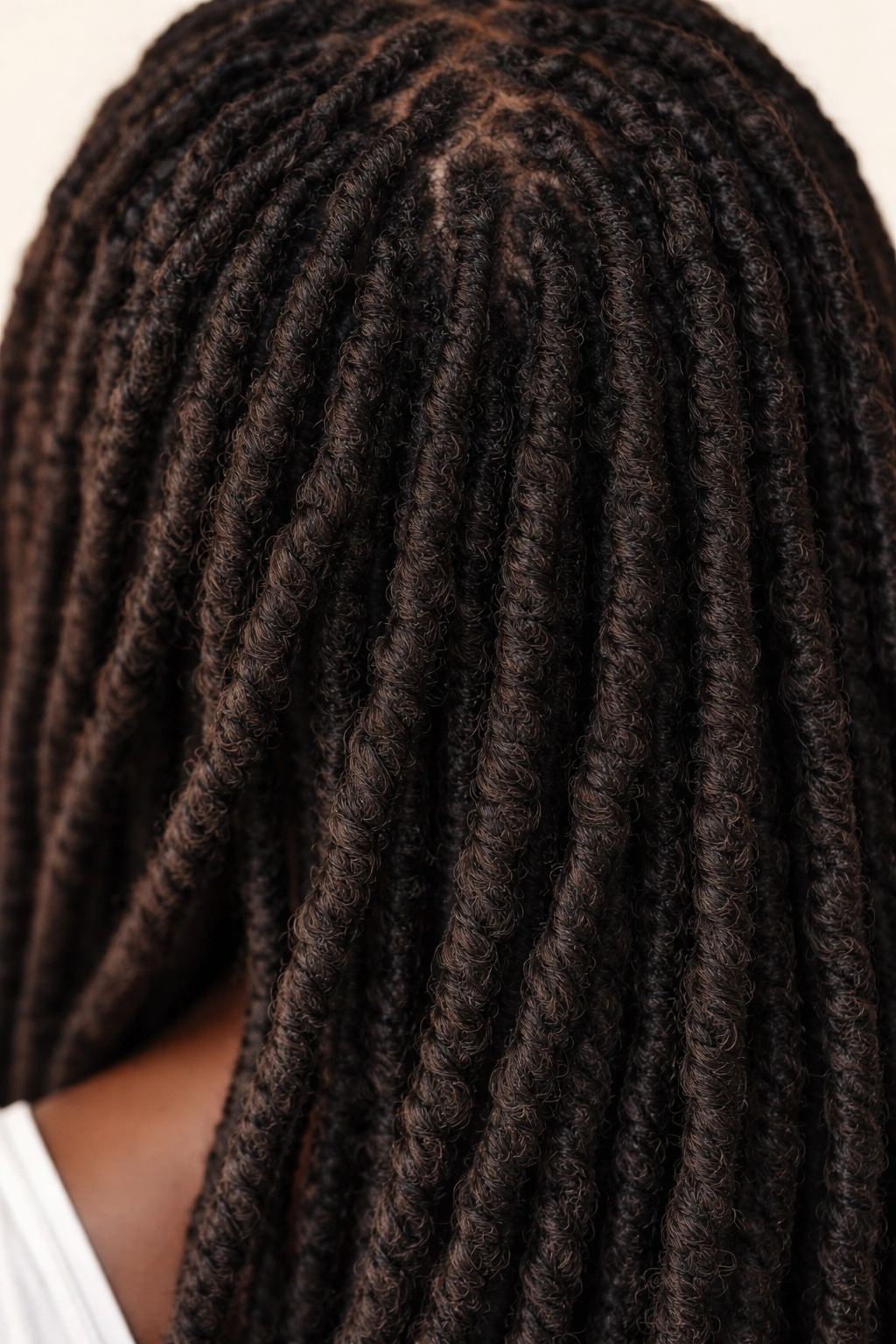 Close-up of rope-like locs on 4C hair with natural shine