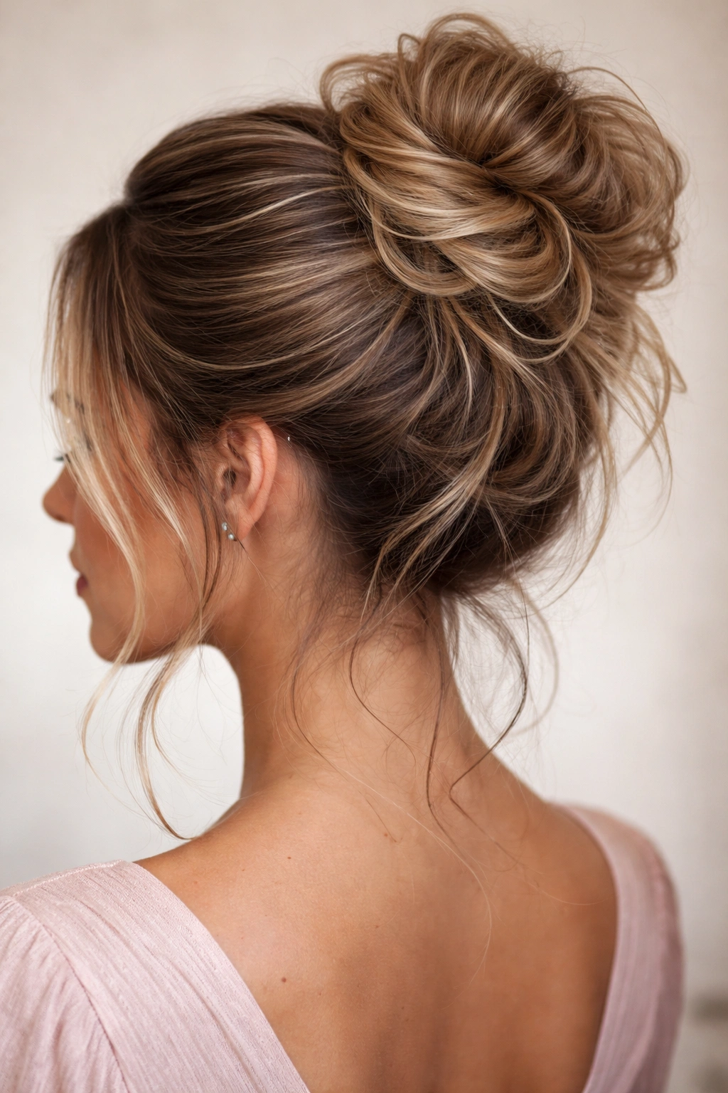 Close-up of a messy bun with extensions blended into natural hair