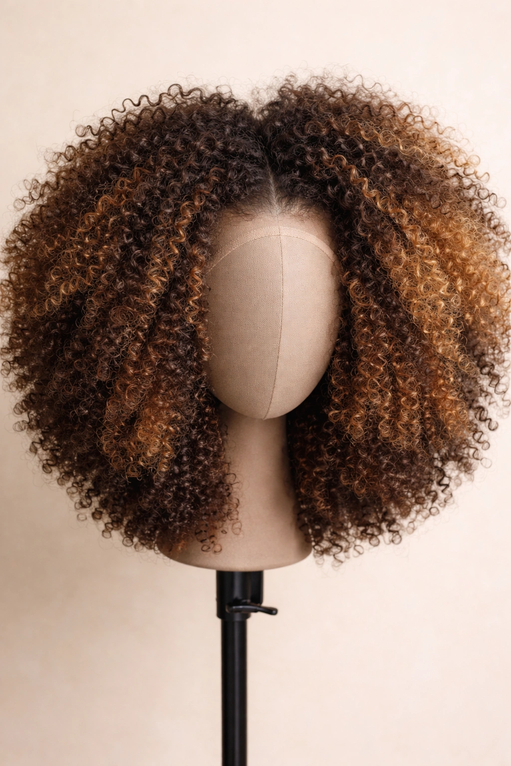 Afro wig with multi-textured blend and subtle color variation on neutral background