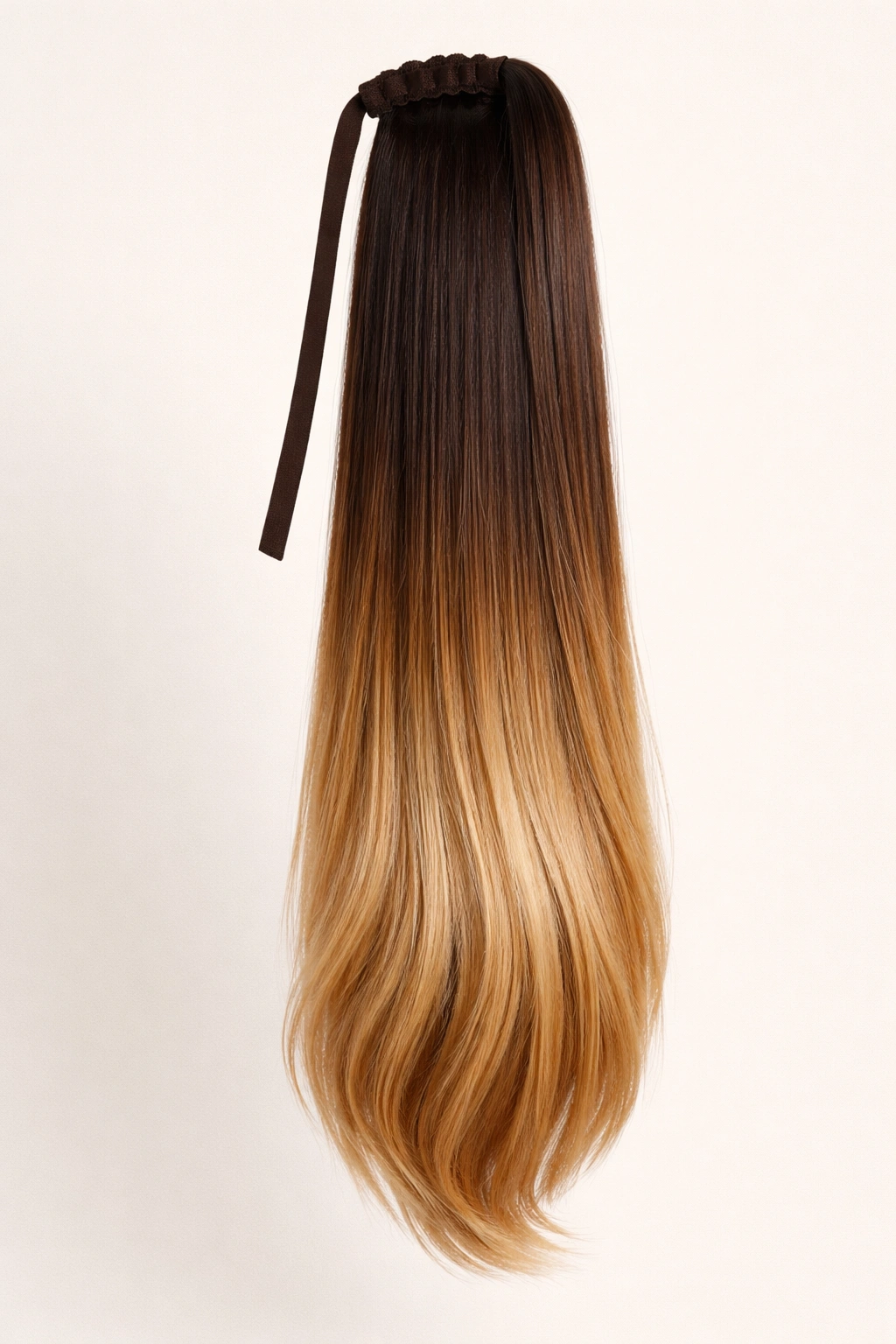 Full-length straight thick ponytail extension with ombré gradient from dark roots to light ends