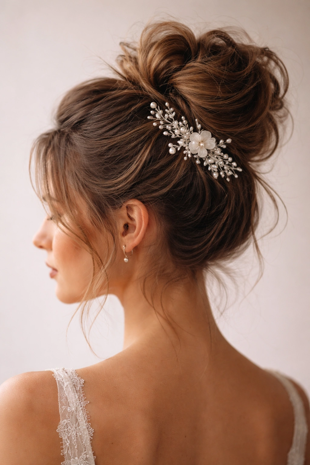 Messy bun with a visible decorative hair ornament positioned asymmetrically