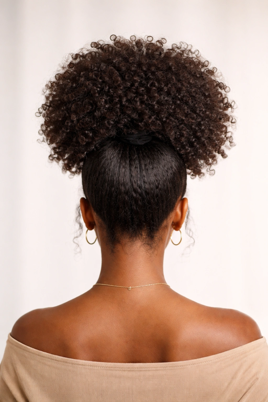 Back view of a high puff ponytail with voluminous Afro curls