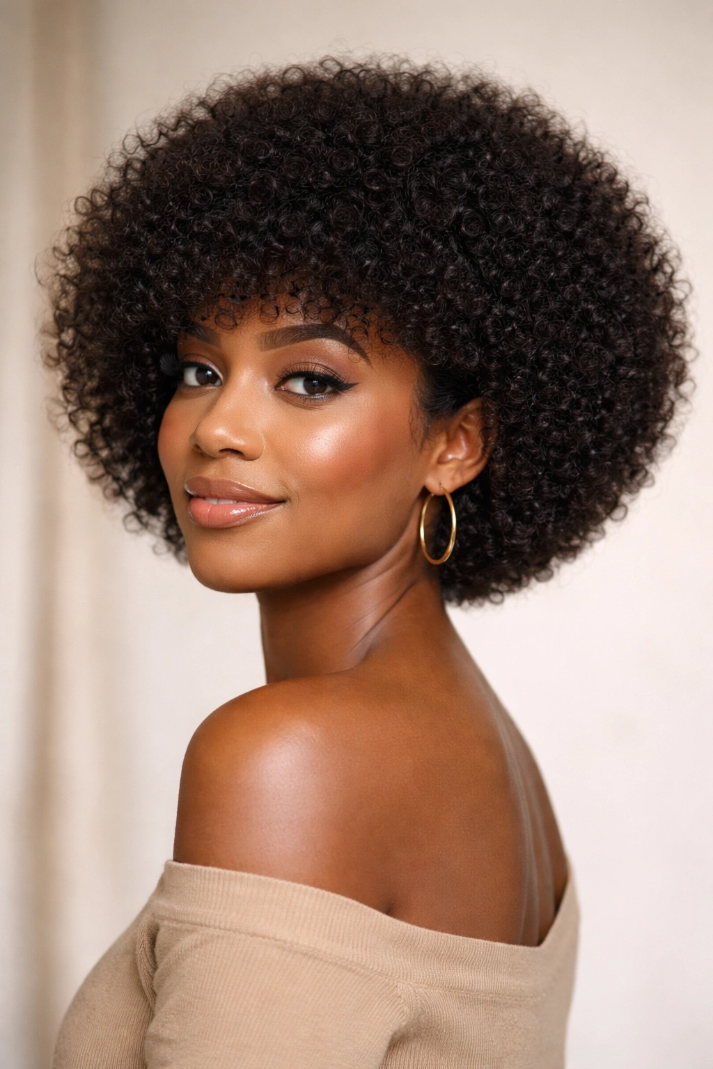 Rounded tapered afro bob with soft curves and balanced silhouette