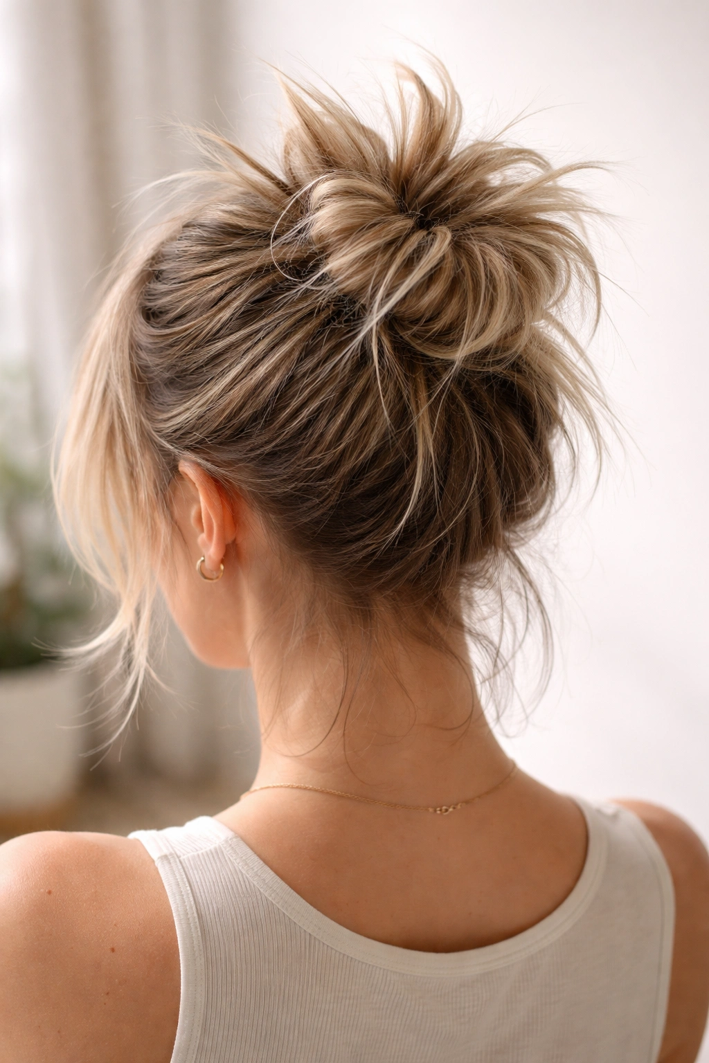 Close-up of Spiky Crown Messy Bun with teased crown and upward spikes