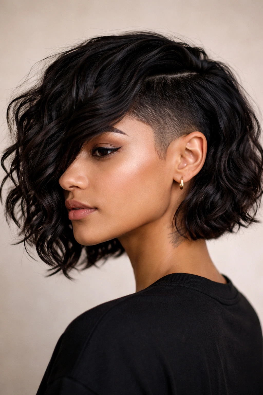 Wavy bob with a disconnected undercut showing top waves and a sharp bottom line.