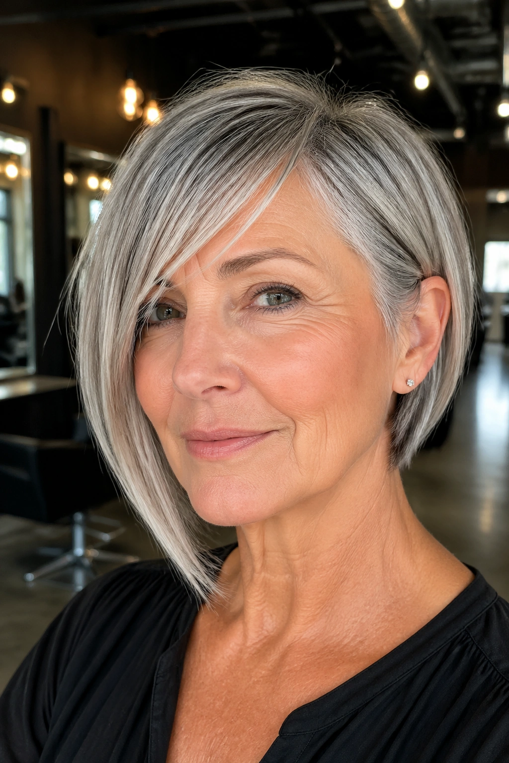 Close-up of a real woman with asymmetrical bob and angled fringe in a modern salon