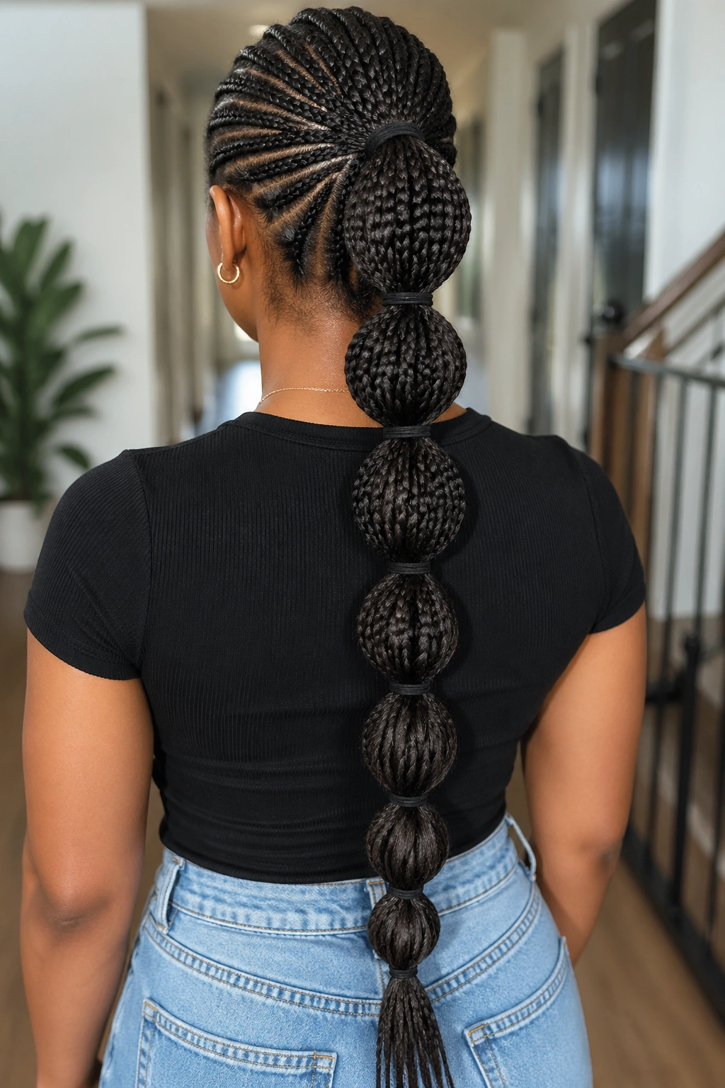 Back view of a real person showing bubble ponytail with multiple elastic bubbles