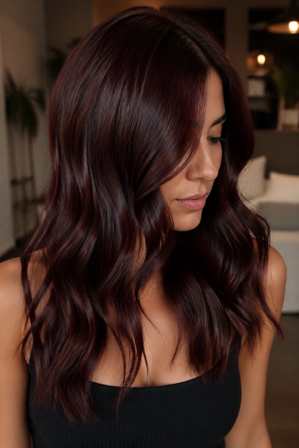 Dark hair with cherry cola red-violet tones and shine