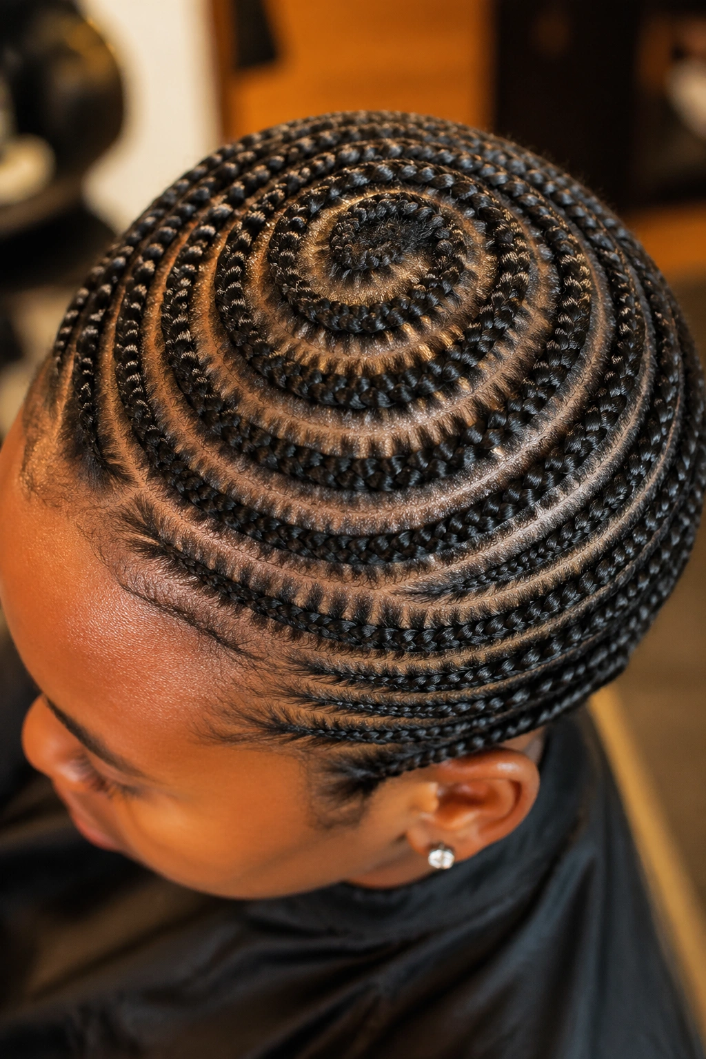 Close-up crown with circular beehive braids on a real person