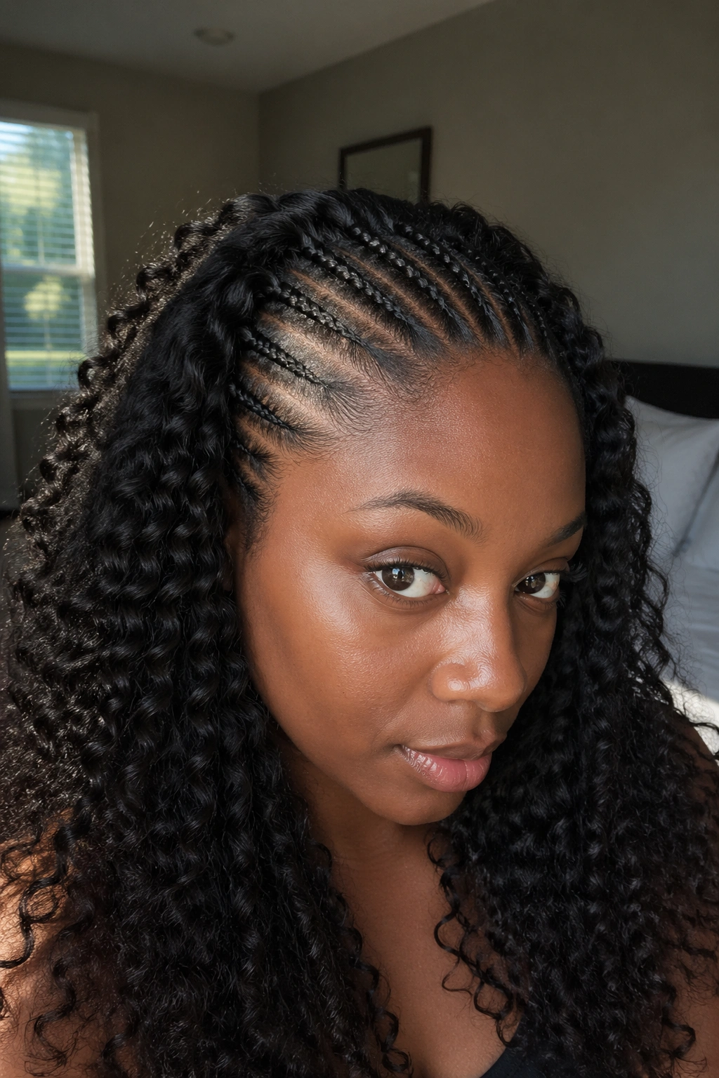 Close-up of a person with crochet braids laid flat on a braided base