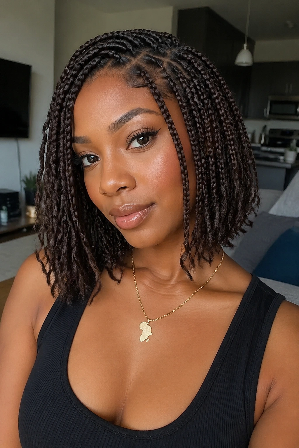 Close-up of dark brown bob boho box braids on a real person