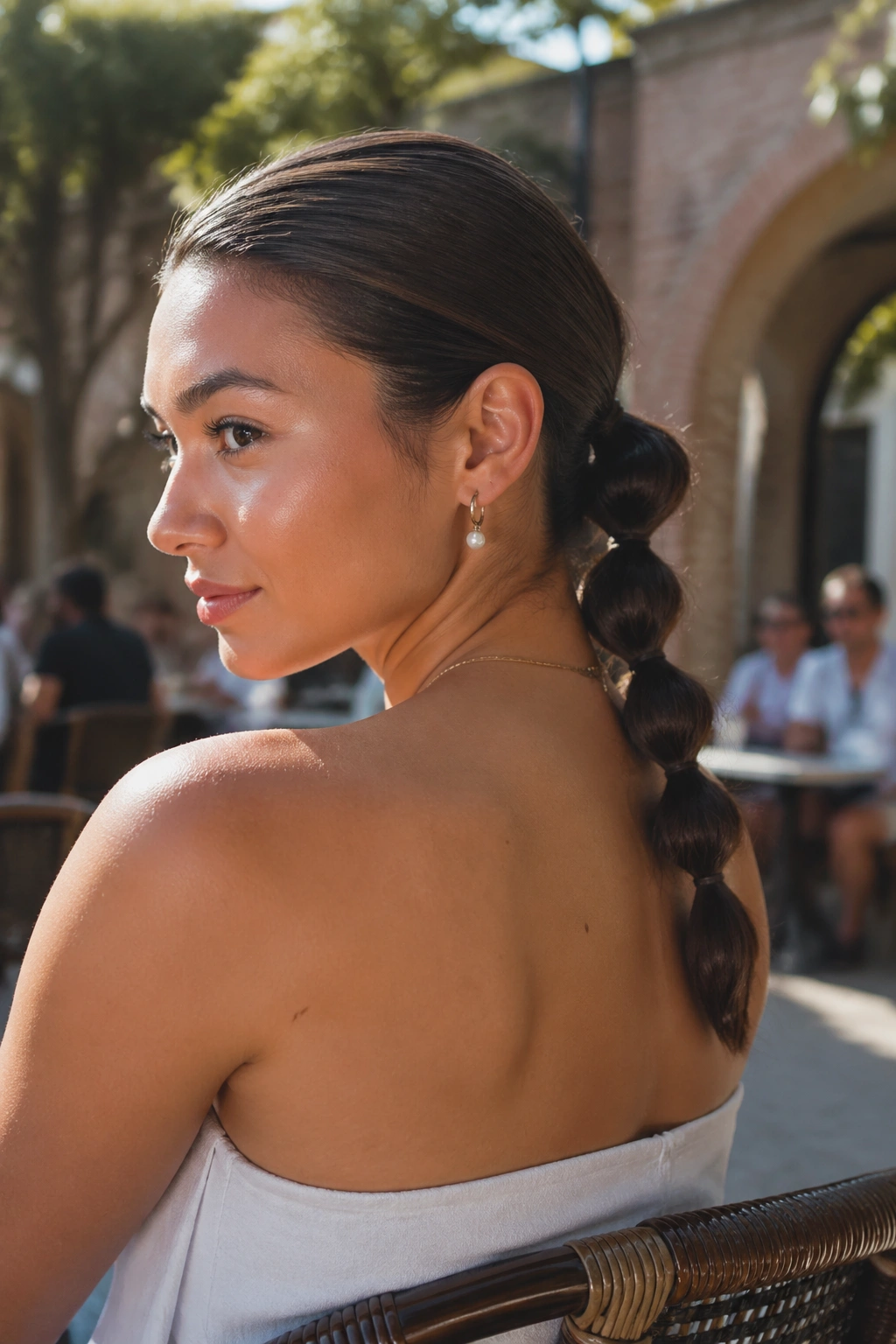 Close-up of Day-Long Bubble Braid That Handles Frizz on a real woman's head in natural light