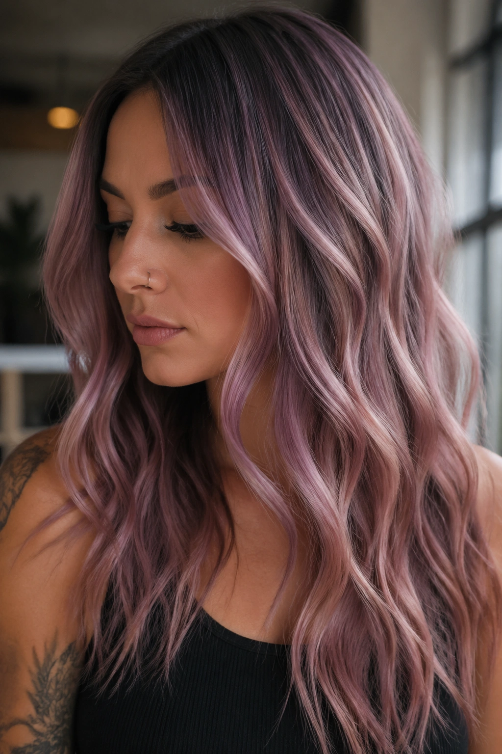 Brunette with dusty mauve pink hair in natural window light