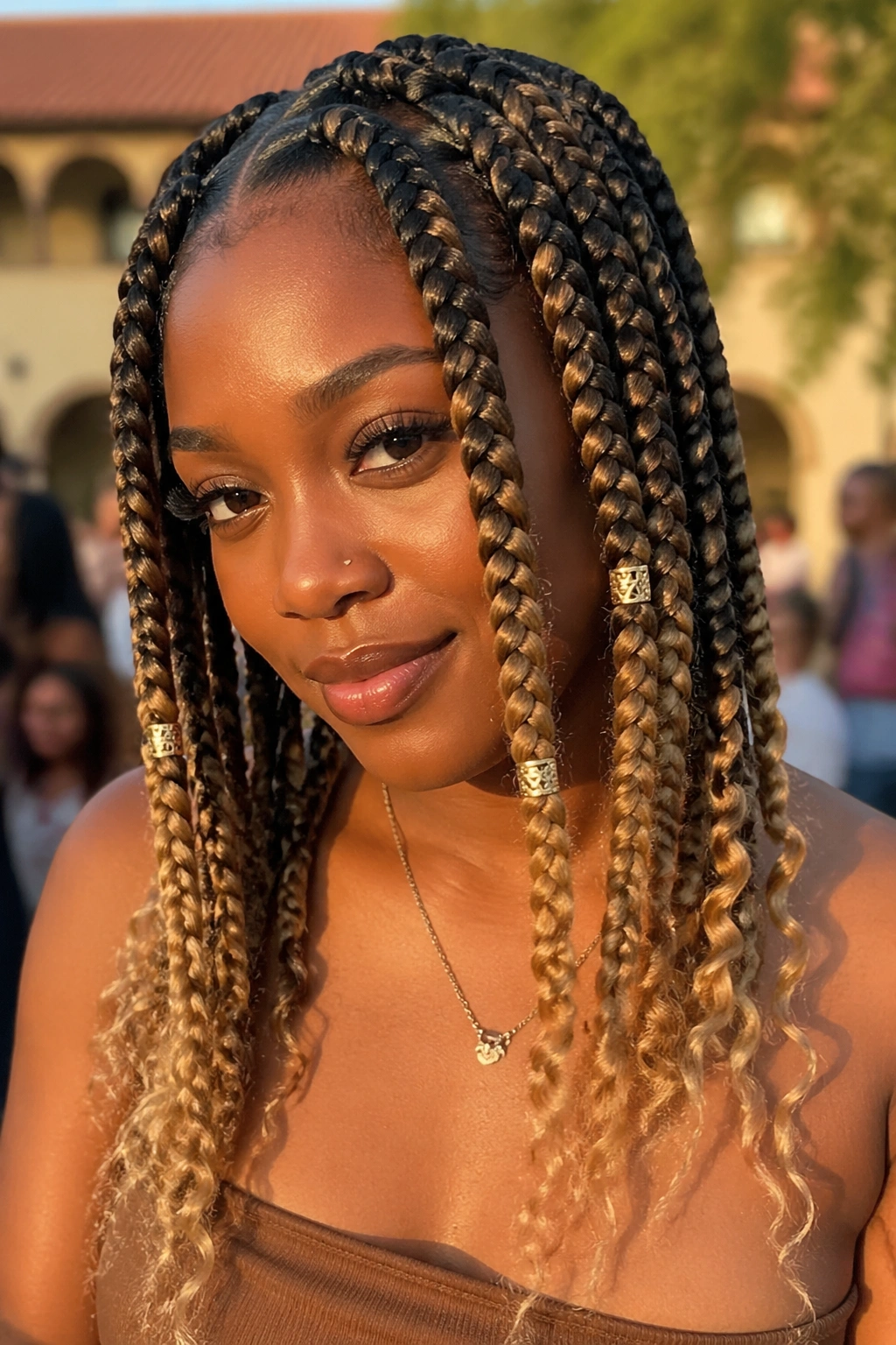 Close-up of jumbo box braids with beads and blonde tips
