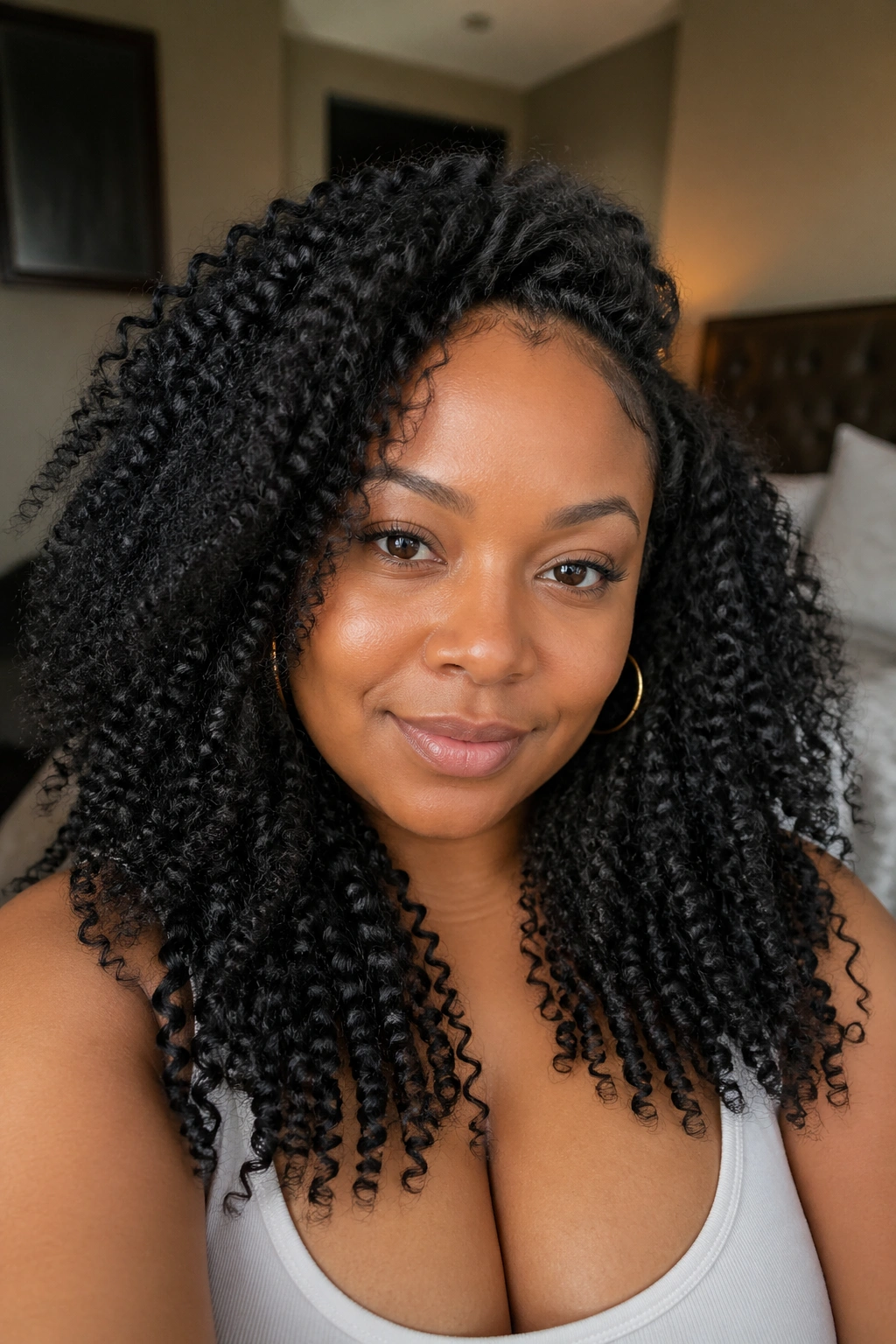 Close-up of a real woman with kinky curly crochet braids framing her face