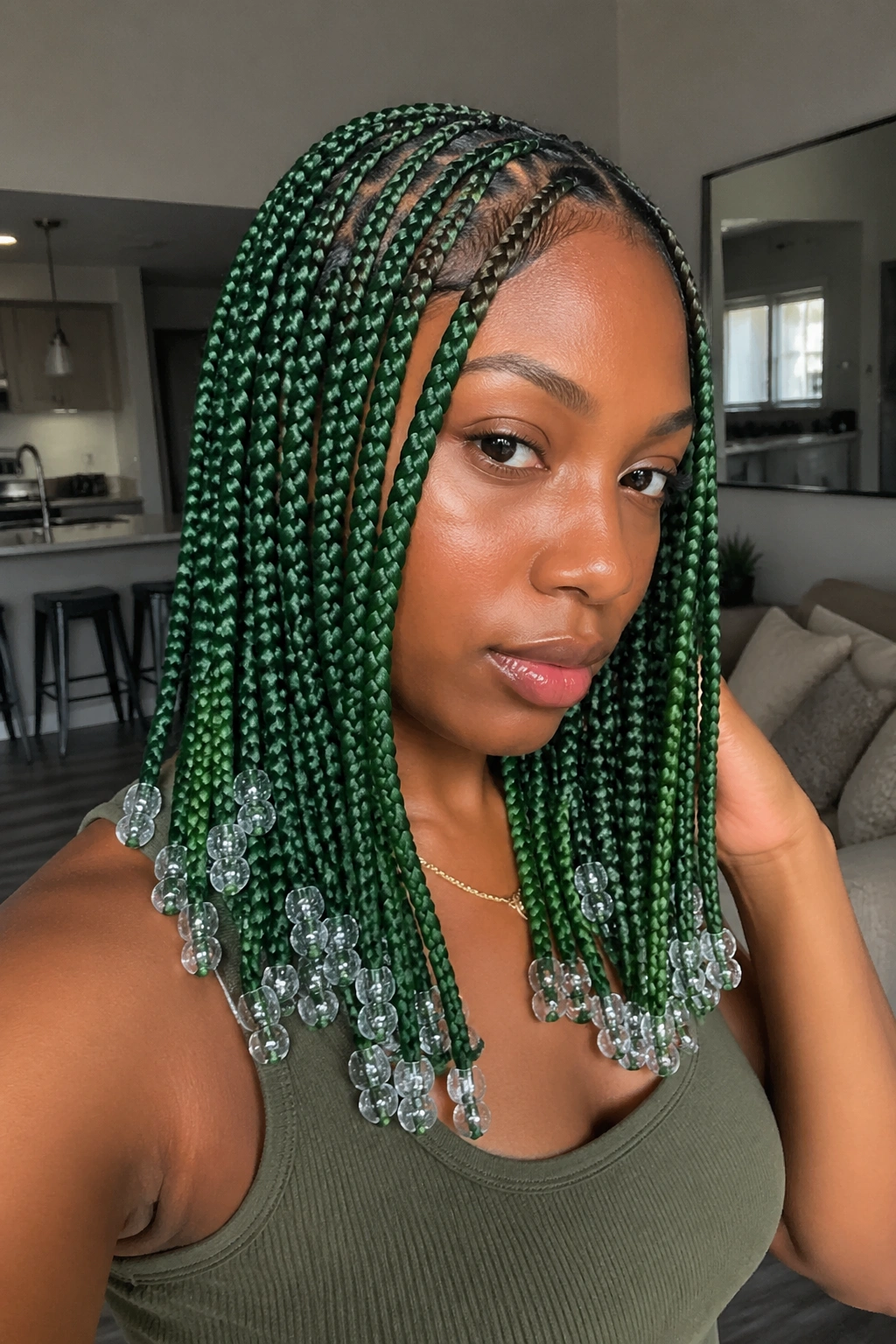 Real person with knotless box braids and crystal beads at the ends