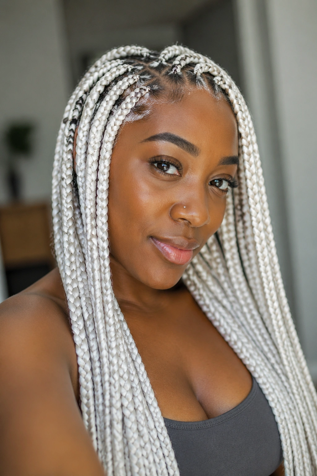Portrait of knotless white box braids with flat roots on a real woman