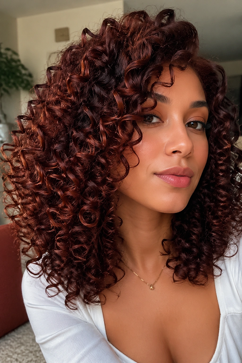 Close-up of real person with mahogany curly hair showing ribbon dimension