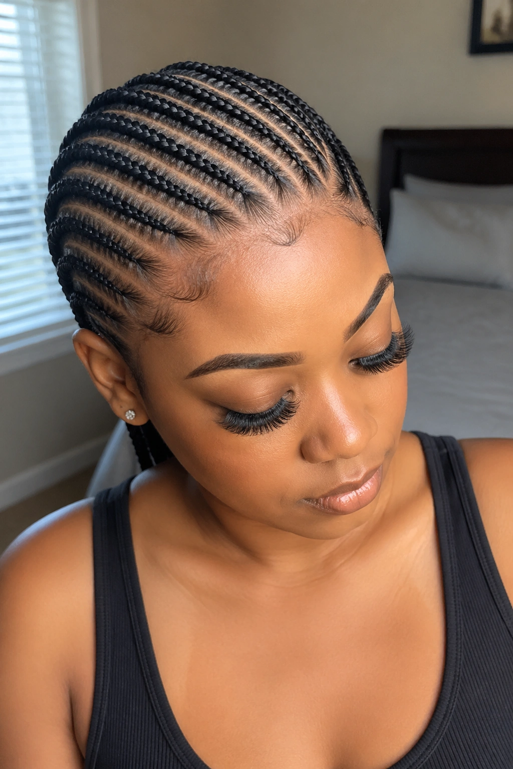 Close-up portrait of a real person with off-center straight back braids for a side-part closure