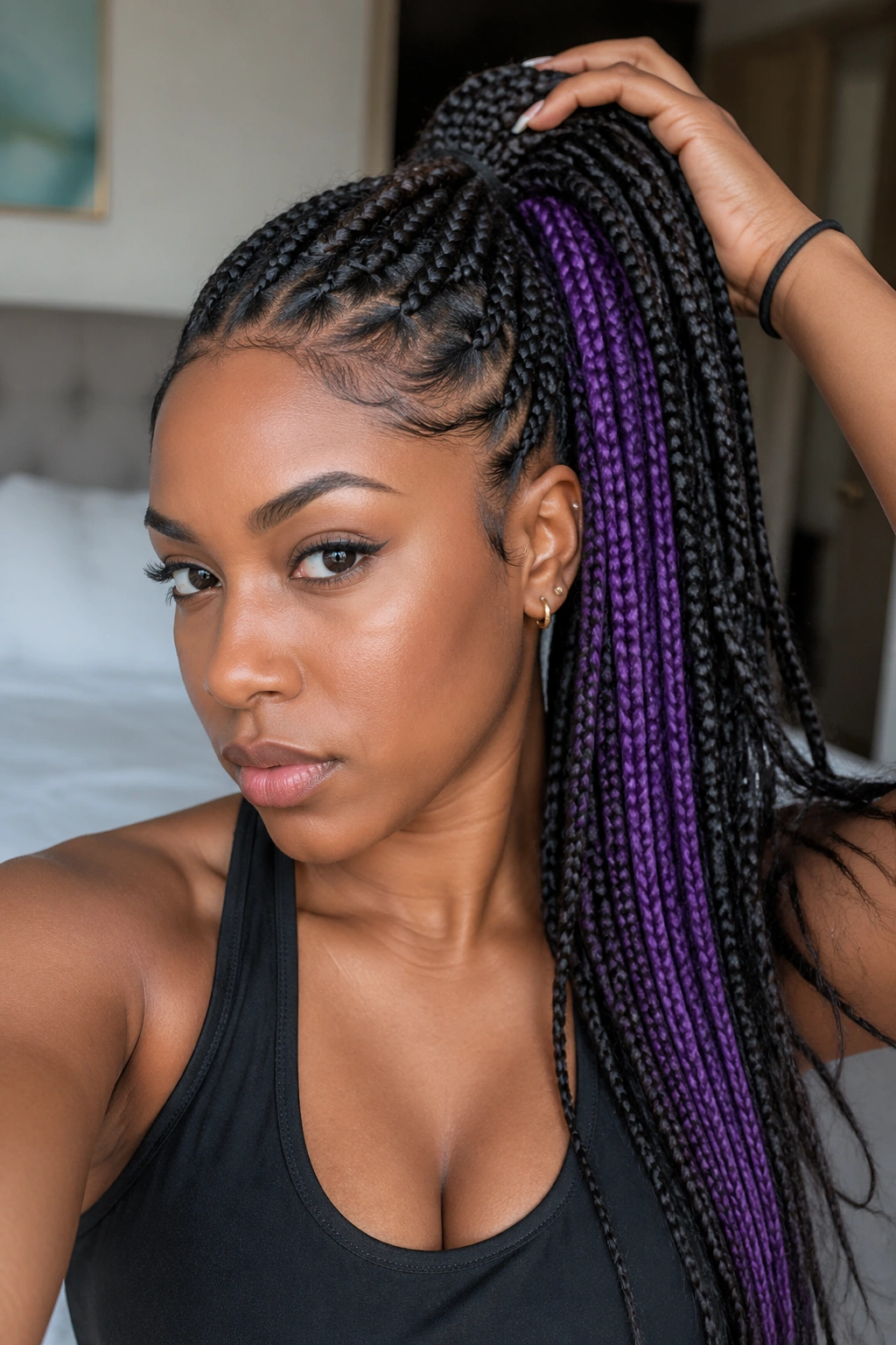 Portrait of a real person with high ponytail braids showing hidden purple underside