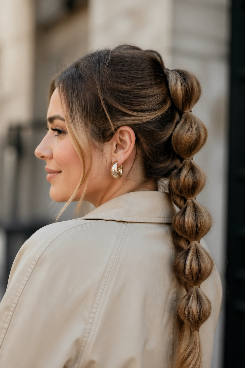 Close-up of a real woman with a pull-through braid look in outdoor daylight