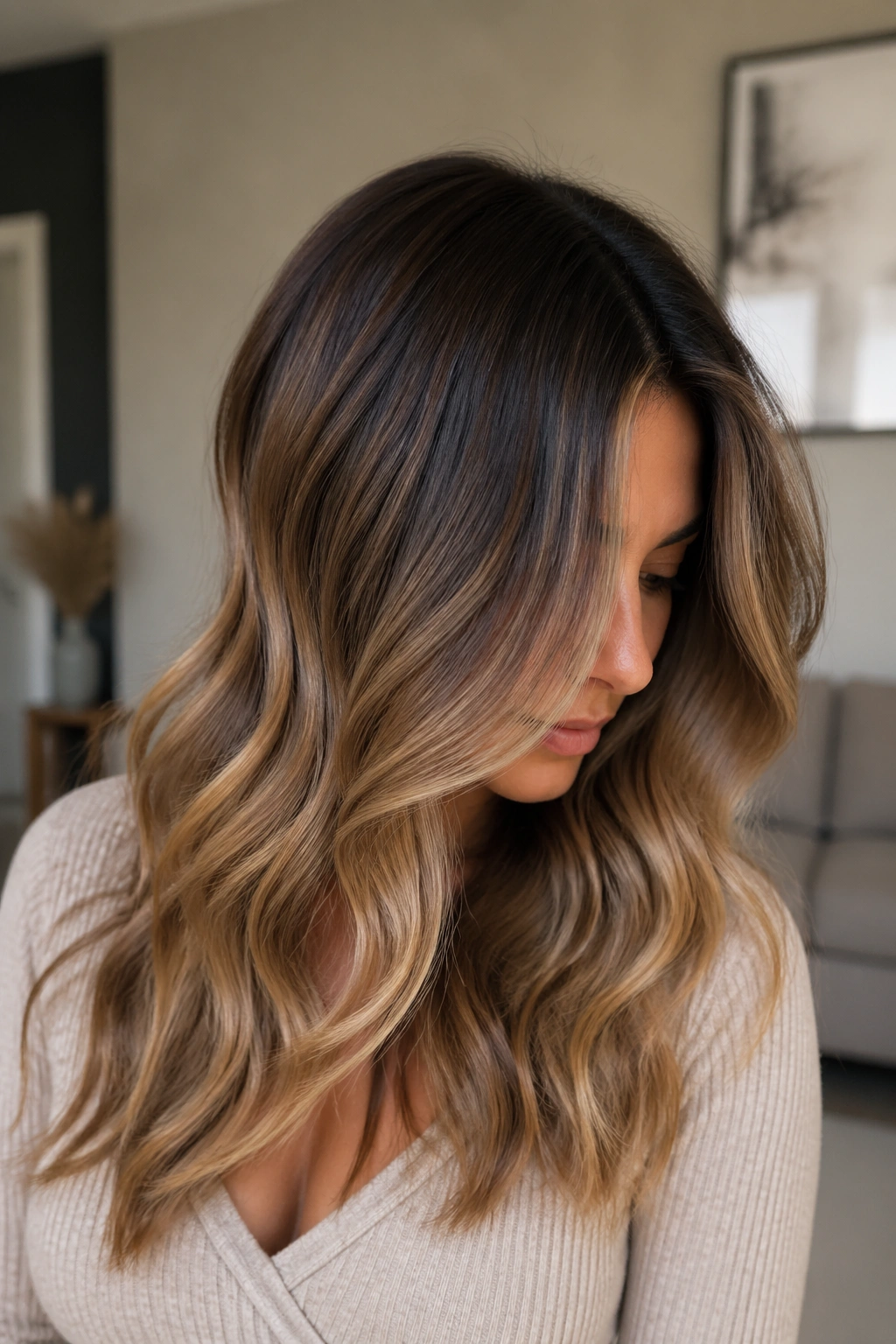 Portrait of a real person with smoked caramel and shadow roots ombre hair