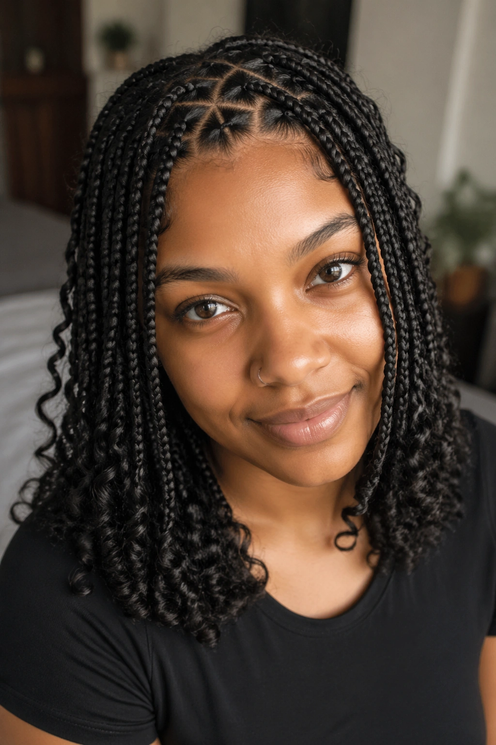Close-up of a real woman with triangle-part small box braids and soft ends