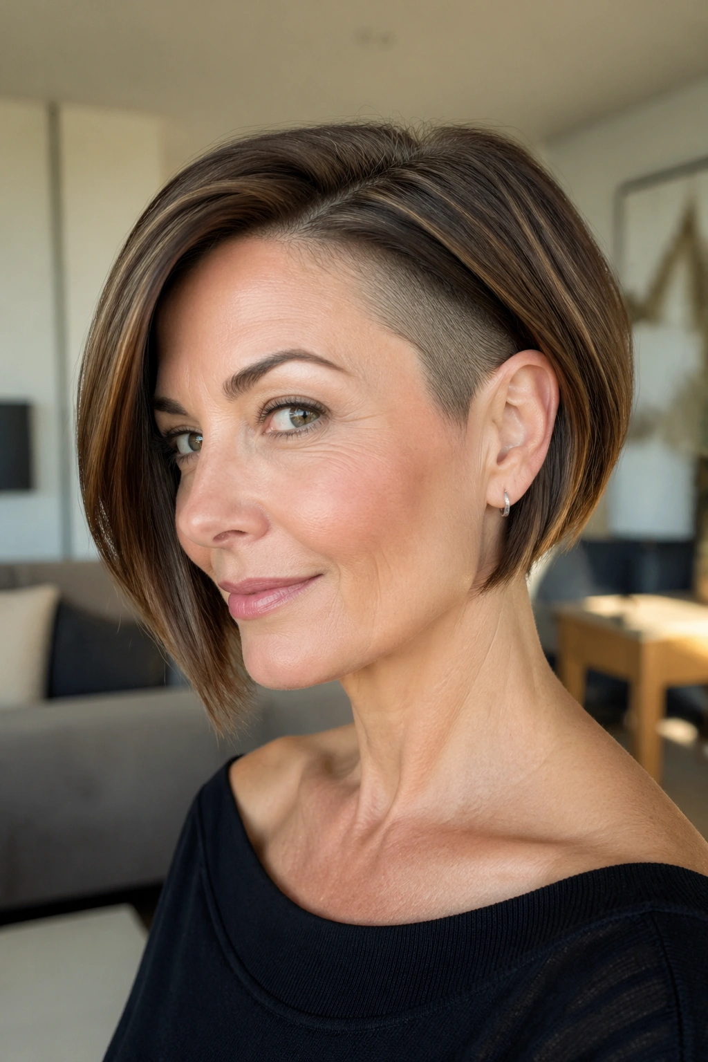 Real woman with tucked bob showing a hidden undercut, in natural light.