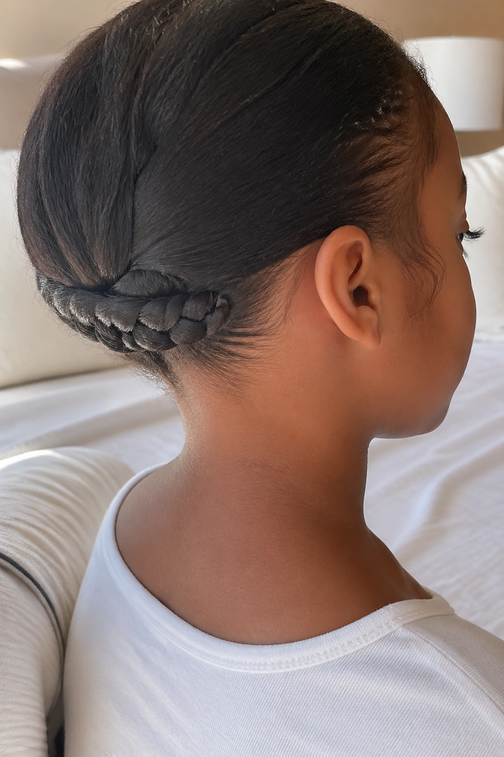 Close-up of a real person's nape with a tucked underbraid neatly hidden under hair.
