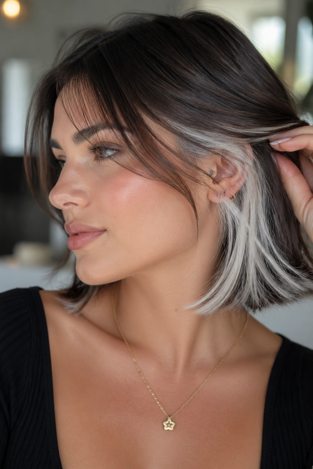 Close-up of a real woman showing white underlights peeking from beneath darker top layer