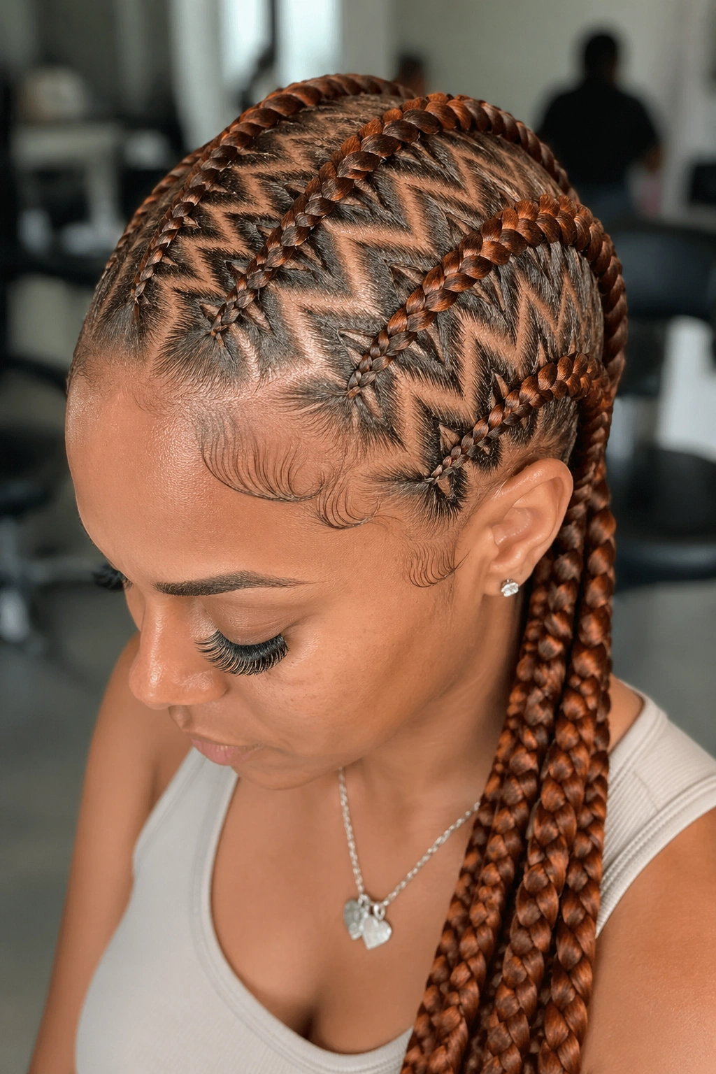 Close-up of zigzag ginger feed-in braids on a real woman