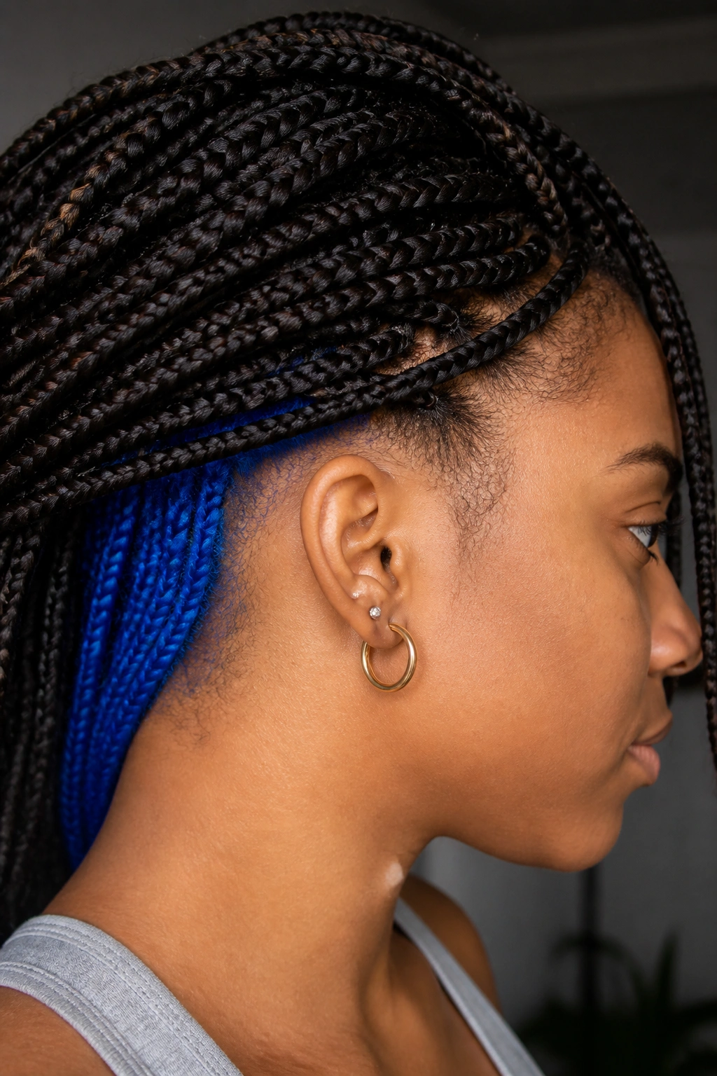 Side profile of a real person showing royal blue peekaboo at the nape