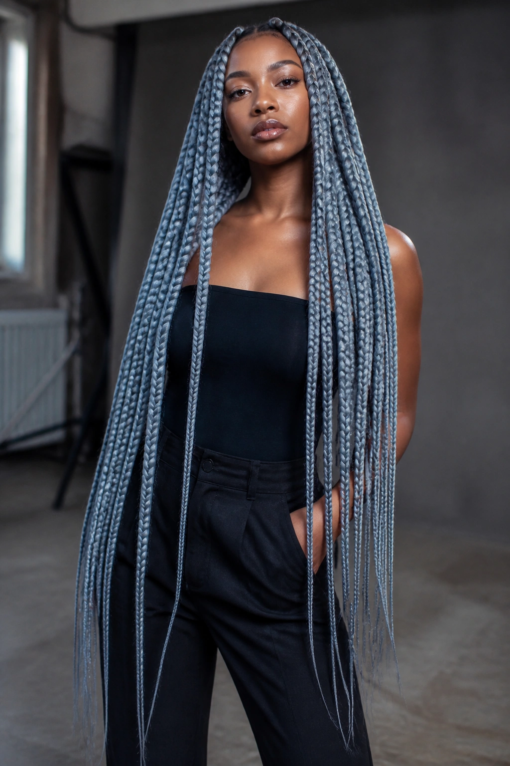 Real person showcasing waist-length icy blue-grey jumbo braids